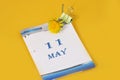 May 11 calendar: table calendar with yellow dandelion, number 11, name of the month May in English.Walk with Mary