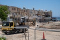 May 11, 2021 Cyprus, Paphos. Construction work with construction equipment and road renovation workers in city near