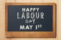 May Day, May 1. Small chalk board with text Labor Day. Internati