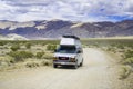 May 27, 2018 Death Valley / CA / USA - Modified GMC minivan travelling on an unpaved road through a remote area of Death Valley;