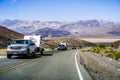 May 28, 2018 Death Valley / CA / USA - Pick up trucks with RV travel trailers driving though Death Valley National Park; Panamint