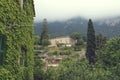 10 May 2018 Deia, Majorca. Beautiful country houses and lush greenery and palm trees in cloudy day Royalty Free Stock Photo