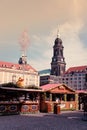 Fair stalls at Altmarkt. Kreuzkirche bellfry on background.