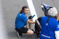 6 may 2023, Estoril, Portugal - MotoGP racing - woman repaer helps with Motorcycle Royalty Free Stock Photo