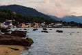 May 1, 2022. Florianopolis, Brazil. Houses in Ribeirao da Ilha village and ocean coastline at sunset Royalty Free Stock Photo