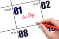 May 1. Hand writing text Lei Day on calendar date. Save the date. Royalty Free Stock Photo