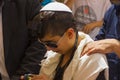 A young Jewish man`s Bar Mitvah at the Western wall jerusalem
