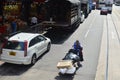 Labor or worker pulling heavily loaded trolley 18 May 2013