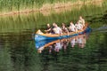 Group of happy people in a kayak boat