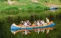 Group of happy people in a kayak boat