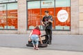 Young hipster man plays the guitar on the street. Rock style