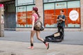 Young hipster man plays the guitar on the street. Rock style