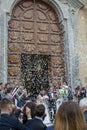 May 25, 2019, Marsala, Italy, Italian catholic wedding in church with many guests and salute from papers and rice