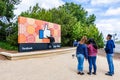 May 26, 2019 Menlo Park / CA / USA - Tourists posing in front of the Facebook Like Button sign located at the entrance to the Royalty Free Stock Photo