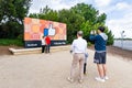 May 26, 2019 Menlo Park / CA / USA - Tourists posing in front of the Facebook Like Button sign located at the entrance to the Royalty Free Stock Photo