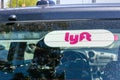 May 30, 2019 Milpitas / CA / USA - Lyft sticker on the rear window of a vehicle offering rides