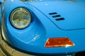 May 2022 Modena, Italy: Blue Ferrari car in the Ferrari Museum close-up. Retro headlight