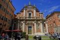 May 2022 Modena, Italy: Church of San Giorgio and people in cafe in thee street on a sunny day