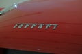 May 2022 Modena, Italy: Ferrari logo icon close-up on red car. details of the sportscar