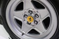 May 2022 Modena, Italy: Ferrari sportscar tire close-up. Ferrari details. Ferrari logo icon