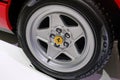 May 2022 Modena, Italy: Ferrari sportscar tire close-up. Ferrari details. red car. Ferrari logo icon close-up