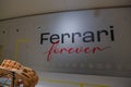 May 2022 Modena, Italy: Interior of the Ferrari museum with text Ferrari forever on the gray wall