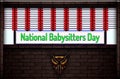 May month special day. National Babysitters Day , Neon Text Effect on Bricks Background