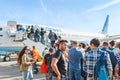 Passengers on the ladder boarding the airplane of the lowcost airline Pobeda