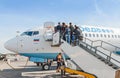 Passengers on the ladder boarding the airplane of the lowcost airline Pobeda