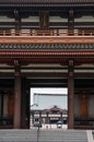 Main entrance gate with wooden Buddha statues of Nittaiji Temple