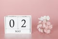 May 02nd. Day 2 of month. Calendar cube on modern pink background, concept of bussines and an importent event