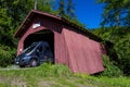 MAY 29, 2019, OREGON - RV drives out of Drift Creek Covered Bridge, Oregon, Built 1914 - Lincoln County near Bear Creek Road