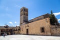 May 2019, Pedraza, Castilla Y Leon, Spain: tourists near Iglesia San Juan Bautista in Plaza Mayor.