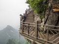 25 May 2018: A photographer preparing for taking pictures at The Cliff Hanging Walkway at Tianmen Mountain, The Heaven`s Gate at