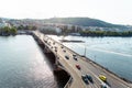 22 May 2022 Prague, Czech Republic. Traffic of cars across the bridge, Vltava River. View of architectural buildings.