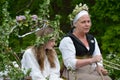 May Queen and her escort in medieval May Day reenactment