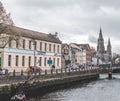 Sullivan`s Quay street, the Nano Nagle Bridge over river Lee, and Saint Fin Barre`s Cathedral in the background.