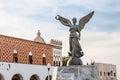 Angel statue of victory in Mandraki harbor in old town of Rodos Royalty Free Stock Photo