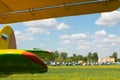 May 22, 2021, Russia, Moscow. biplane an-2 in the parking lot at the airfield on the green lawn. Rows of small aircraft