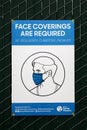 May 14, 2021 Santa Monica California, USA: Wear a Face Mask sign to stay safe from the Corona Virus. A sign posted on a fence to