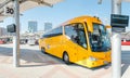 yellow buse of Regiojet company at the boarding of passengers at the bus station of Bratislava