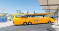 Yellow buse of Regiojet company at the boarding of passengers at the bus station of Bratislava