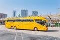 yellow buse of Regiojet company at the boarding of passengers at the bus station of Bratislava