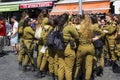 A small group of off duty female Israeli Army conscripts with an armed guard laugh and chat together at the Mahane Yehuda street m