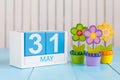 May 31st. Image of may 31 wooden color calendar on white background with flowers. Last spring day, Spring end. Empty