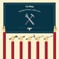 May 1st International Labor Day poster. Worker hand holding tools.