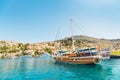 Colorful island Symi - popular tourist attraction with fishing boats in a harbor Royalty Free Stock Photo