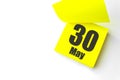 May 30th. Day 30 of month, Calendar date. Close-Up Blank Yellow paper reminder sticky note on White Background. Spring month, day