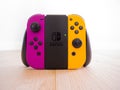 May 2020, UK: Nintendo switch grip controller with orange and purple joy con remote