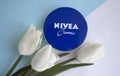 May 4, 2022 Ukraine, Kyiv cream Nivea with flower tulips